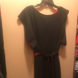 Women’s black dress with red trim and belt